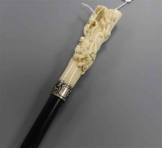 A 19th century German ebonised walking cane with carved ivory handle L.92cm